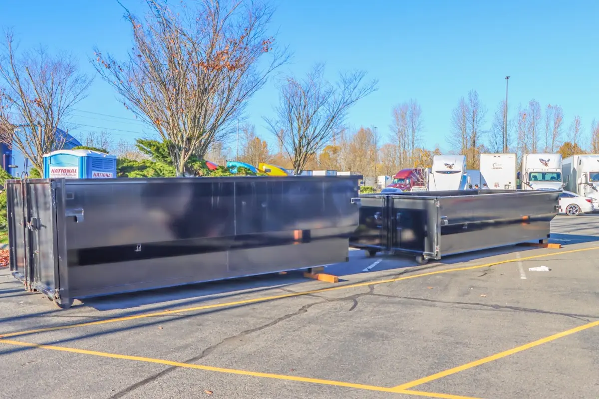 Professional dumpster rental service with roll-off container on residential driveway in Morton Grove